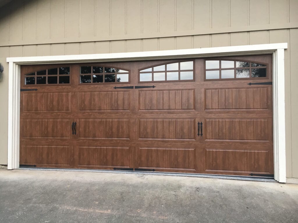 picture of a wood look new garage door.