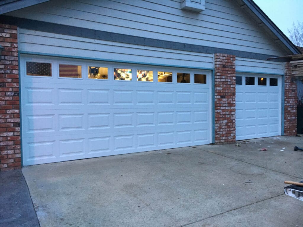 Image of a double and single garage door installed in a home.