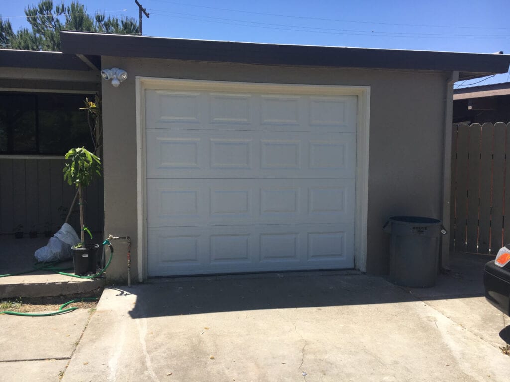 image of a garage door installed in a home.